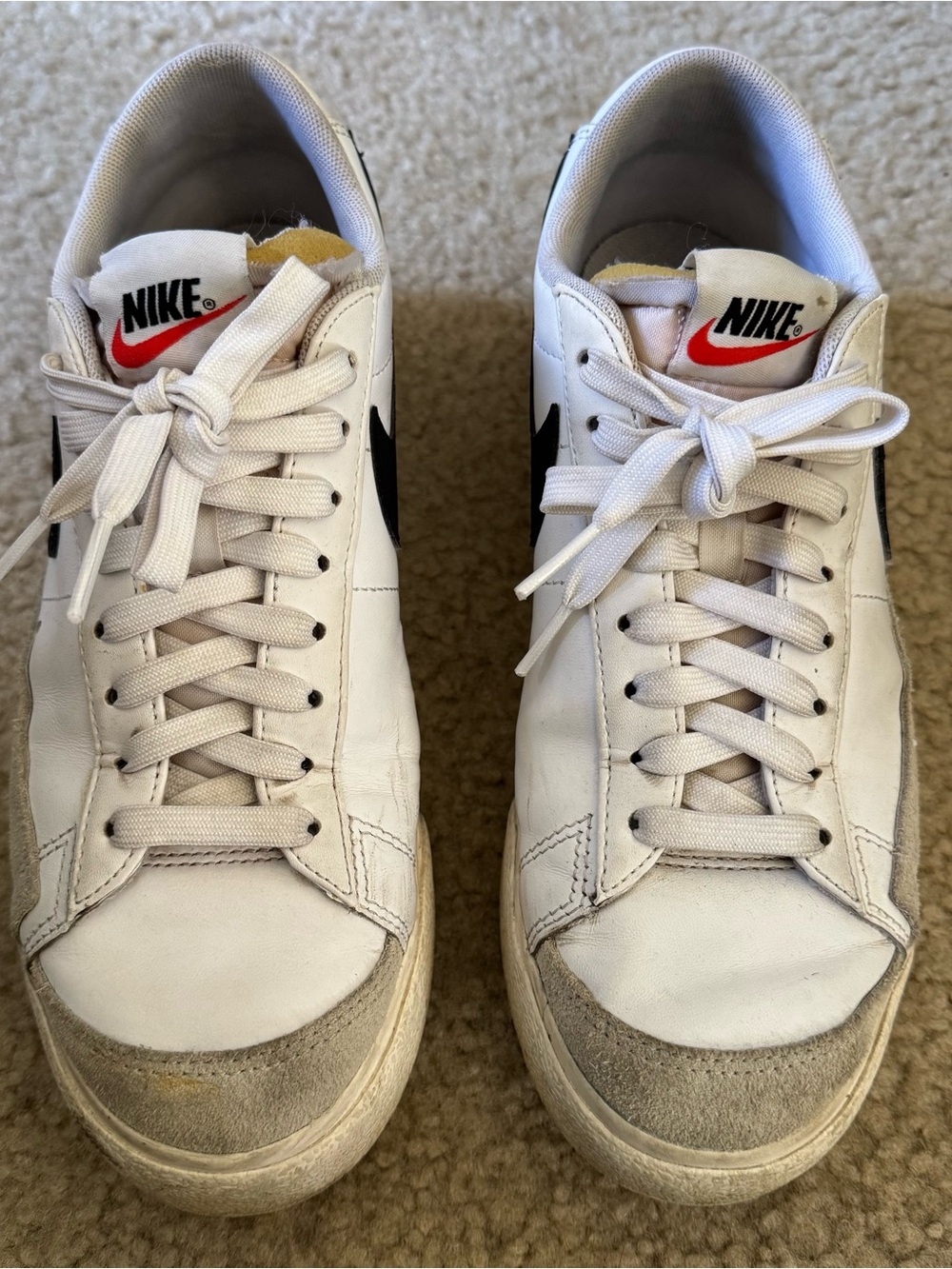 Nike Women’s White Sneakers with Black Swoosh and Red Tongue Logo
